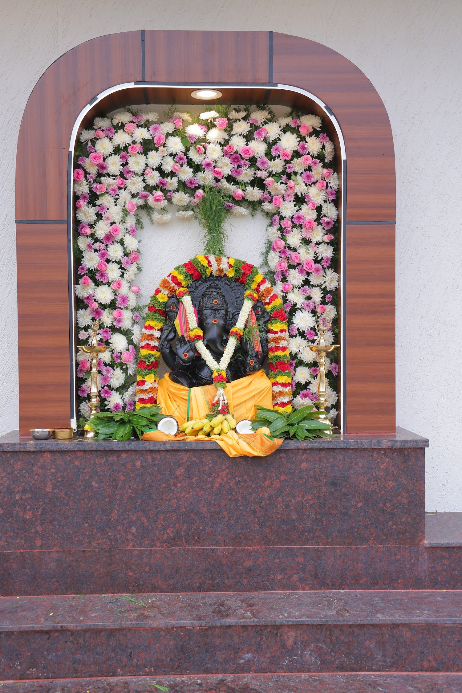 Hand-painted heritage shrine decor at Akshaya Milan, Bengaluru